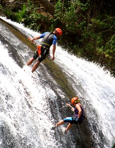 Featured is a photo of a couple rappeling down a waterfall...certainly an adventurous way to travel...by photographer Thiago Miqueais of Sao Paulo, Brazil.